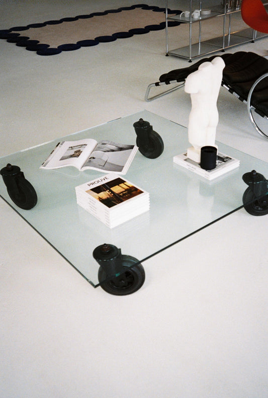 Gae Aulenti Glass Coffee Table with Industrial Cart Wheels, 1980s Fontana Arte